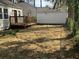 Fenced backyard with detached single-car garage and wooden deck at 1132 Fair St, Atlanta, GA 30314