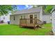 Small deck and green lawn in backyard with house at 1132 Fair St, Atlanta, GA 30314