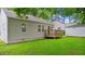 Yard with grassy lawn plus back of house with small deck at 1132 Fair St, Atlanta, GA 30314