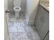 Bathroom featuring marble floors and granite countertops at 1132 Fair St, Atlanta, GA 30314