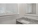 Bathroom featuring granite counters, modern fixtures, and white cabinets at 1132 Fair St, Atlanta, GA 30314