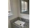 Bathroom vanity features gray cabinets and a granite countertop with a modern sink at 1132 Fair St, Atlanta, GA 30314