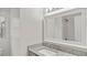 Bathroom featuring granite counters, modern fixtures, and white cabinets at 1132 Fair St, Atlanta, GA 30314