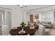 Inviting dining area flows to living room and has a wood table set for a meal at 1132 Fair St, Atlanta, GA 30314