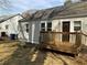 Charming home exterior with a small wood deck and neutral-colored siding near the back entry door at 1132 Fair St, Atlanta, GA 30314
