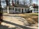 Charming single-Gathering home featuring a concrete driveway, well-kept lawn, and a detached garage at 1132 Fair St, Atlanta, GA 30314