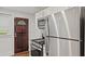 Updated kitchen featuring stainless steel appliances, granite countertops, and dark stained doors at 1132 Fair St, Atlanta, GA 30314
