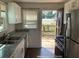 Open kitchen with stainless steel appliances, granite countertops, and access to outdoor deck at 1132 Fair St, Atlanta, GA 30314