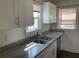Kitchen with granite countertops, stainless steel appliances, and modern fixtures at 1132 Fair St, Atlanta, GA 30314