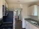 Modern kitchen featuring white cabinets, stainless steel appliances, and granite countertops at 1132 Fair St, Atlanta, GA 30314