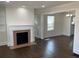 Spacious living room with a fireplace, hardwood floors, and natural light at 1132 Fair St, Atlanta, GA 30314