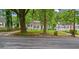 Charming one-story home with manicured lawn and traditional appeal amidst mature trees at 1132 Fair St, Atlanta, GA 30314