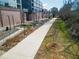 Concrete Beltline path bordered by landscaping and greenery, with bridge in background at 480 James P Brawley Nw Dr, Atlanta, GA 30318