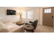 Cozy living room featuring a modern sofa, chair, and round wooden coffee tables set against a light-filled backdrop at 480 James P Brawley Nw Dr, Atlanta, GA 30318