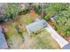 An aerial perspective displays the house and surrounding lush, mature landscaping at 1703 Alton Way, Marietta, GA 30062