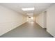 A clean, unfinished basement with white walls and a gray floor, offering potential for customization and expansion at 1703 Alton Way, Marietta, GA 30062