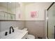 Bathroom features a clean design with gray wainscoting and modern matte black fixtures at 1703 Alton Way, Marietta, GA 30062