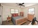 Bedroom with wood-look floors, ceiling fan, a large window, and natural wood furniture set at 1703 Alton Way, Marietta, GA 30062