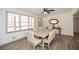 Bright dining room with wood floors, neutral colors, and a modern ceiling fan at 1703 Alton Way, Marietta, GA 30062