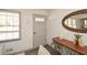 Inviting entryway with light-grey door, stylish decor, and wood floors at 1703 Alton Way, Marietta, GA 30062
