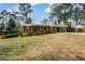 Quaint brick home with well-manicured lawn and covered parking at 1703 Alton Way, Marietta, GA 30062