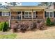 Charming brick home with a covered front porch and classic shutters at 1703 Alton Way, Marietta, GA 30062