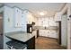 Updated kitchen with white cabinets, granite countertops, and stainless steel appliances at 1703 Alton Way, Marietta, GA 30062