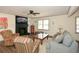 Comfortable living room featuring a fireplace, ceiling fan, and neutral colors at 1703 Alton Way, Marietta, GA 30062