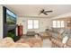 Bright and inviting living room with a fireplace, ceiling fan, and cozy seating area at 1703 Alton Way, Marietta, GA 30062