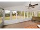 Sunroom with abundant natural light and views of the backyard. Seating is available, making this room ideal for relaxation at 1703 Alton Way, Marietta, GA 30062