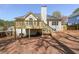 View of the backyard showing the wooden deck with access to the yard and a wood privacy fence at 2037 Castlemaine Circle, Woodstock, GA 30189