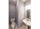 Small bathroom with a toilet, sink, and neutral paint color at 2037 Castlemaine Circle, Woodstock, GA 30189