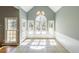 Sun-filled dining area with a high ceiling, multiple windows, and a chandelier at 2037 Castlemaine Circle, Woodstock, GA 30189