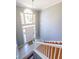 Bright foyer with hardwood stairs, tile flooring, and a large window over the front door at 2037 Castlemaine Circle, Woodstock, GA 30189