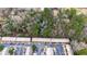 Aerial view of complex featuring parking, mature trees, and brick construction at 2469 Stone Rd, East Point, GA 30344