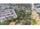 The aerial view displays the lot's placement amid residential buildings and power lines, offering seclusion at 2469 Stone Rd, East Point, GA 30344