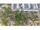 Aerial view of wooded homesite, adjacent to townhomes, offering a serene and private building location at 2469 Stone Rd, East Point, GA 30344