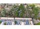 Aerial view of complex featuring parking, mature trees, and brick construction at 2469 Stone Rd, East Point, GA 30344