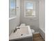 This bathroom offers a single sink vanity, wood floors and a shower/tub combo at 708 Morris Rd, Hiram, GA 30141