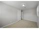 A neutral-toned bedroom features carpeted flooring and white doors at 708 Morris Rd, Hiram, GA 30141