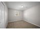 This room features carpeting and a window letting in natural sunlight at 708 Morris Rd, Hiram, GA 30141