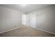 A carpeted bedroom features two white doors and neutral paint at 708 Morris Rd, Hiram, GA 30141
