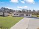 Aerial view of the home featuring a spacious front yard, long driveway and an additional building in the back at 708 Morris Rd, Hiram, GA 30141