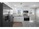Well-lit kitchen with stainless appliances, white cabinets, and granite countertops at 708 Morris Rd, Hiram, GA 30141