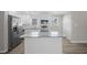 Modern kitchen with stainless steel appliances, granite countertops, and a center island at 708 Morris Rd, Hiram, GA 30141