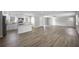 Spacious open-concept living area featuring new floors, a modern kitchen, and plenty of natural light at 708 Morris Rd, Hiram, GA 30141