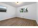 Well-lit bedroom with neutral walls, hardwood floors and double windows at 1894 Evans Sw Dr, Atlanta, GA 30310