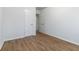 Spacious bedroom featuring hardwood floors, white walls, and closet doors at 1894 Evans Sw Dr, Atlanta, GA 30310