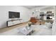 Stylishly furnished living room with modern decor, open to the bright kitchen, perfect for entertaining at 1894 Evans Sw Dr, Atlanta, GA 30310