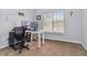 Cozy bedroom showcasing a large window and natural light, suitable for an office space at 6274 Katelyn Park, Lithonia, GA 30058